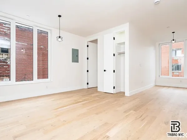 a view of an empty room with a window