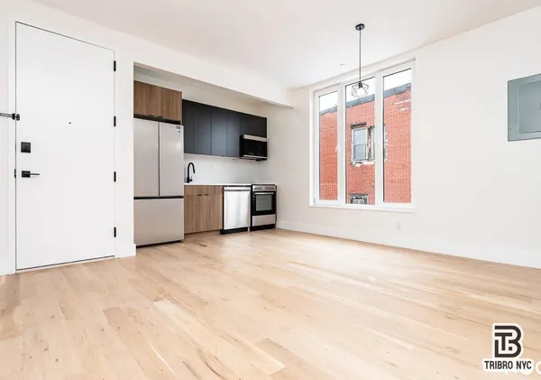 a view of a kitchen with a sink and a microwave