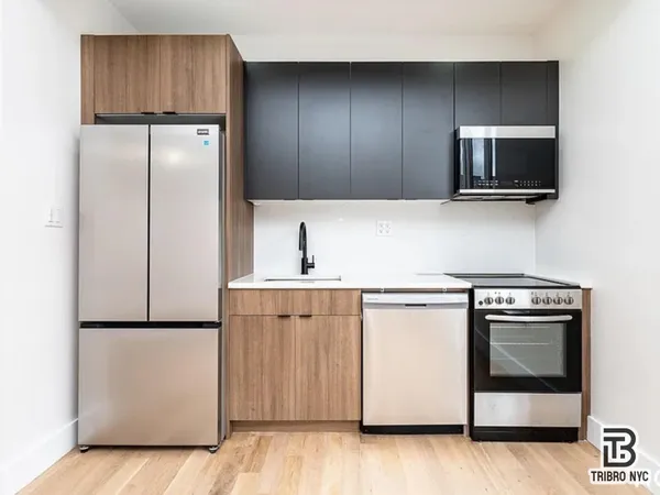 a kitchen with a sink and a microwave