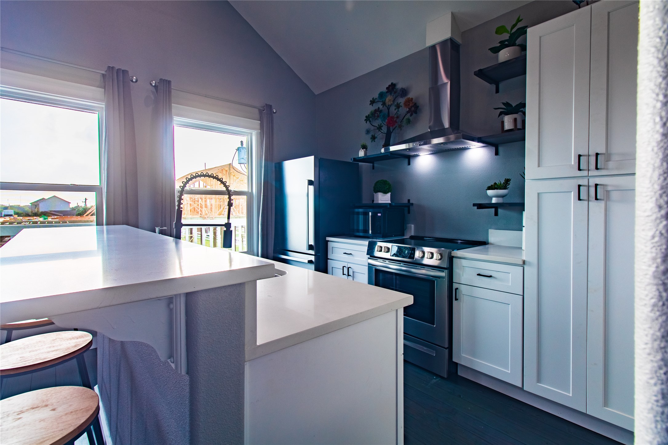 1040 Johnson Road Port Bolivar, TX 77650 - Photo 13 of 49 a kitchen with stainless steel appliances a sink cabinets and wooden floor