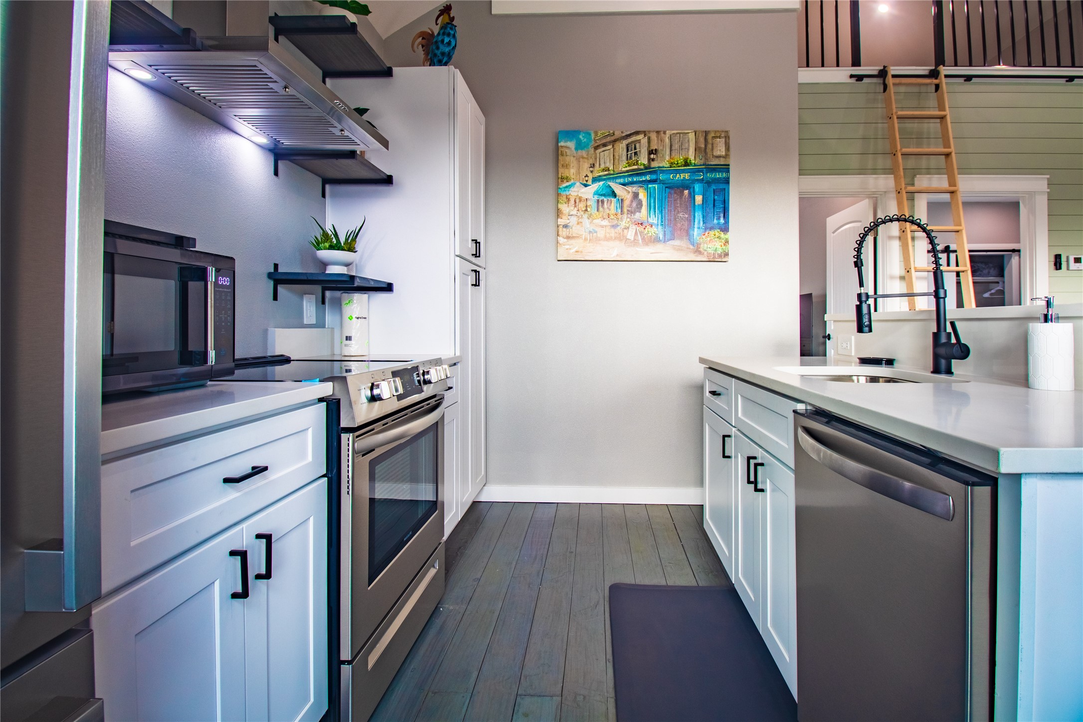 1040 Johnson Road Port Bolivar, TX 77650 - Photo 15 of 49 a kitchen with stainless steel appliances a sink stove and cabinets