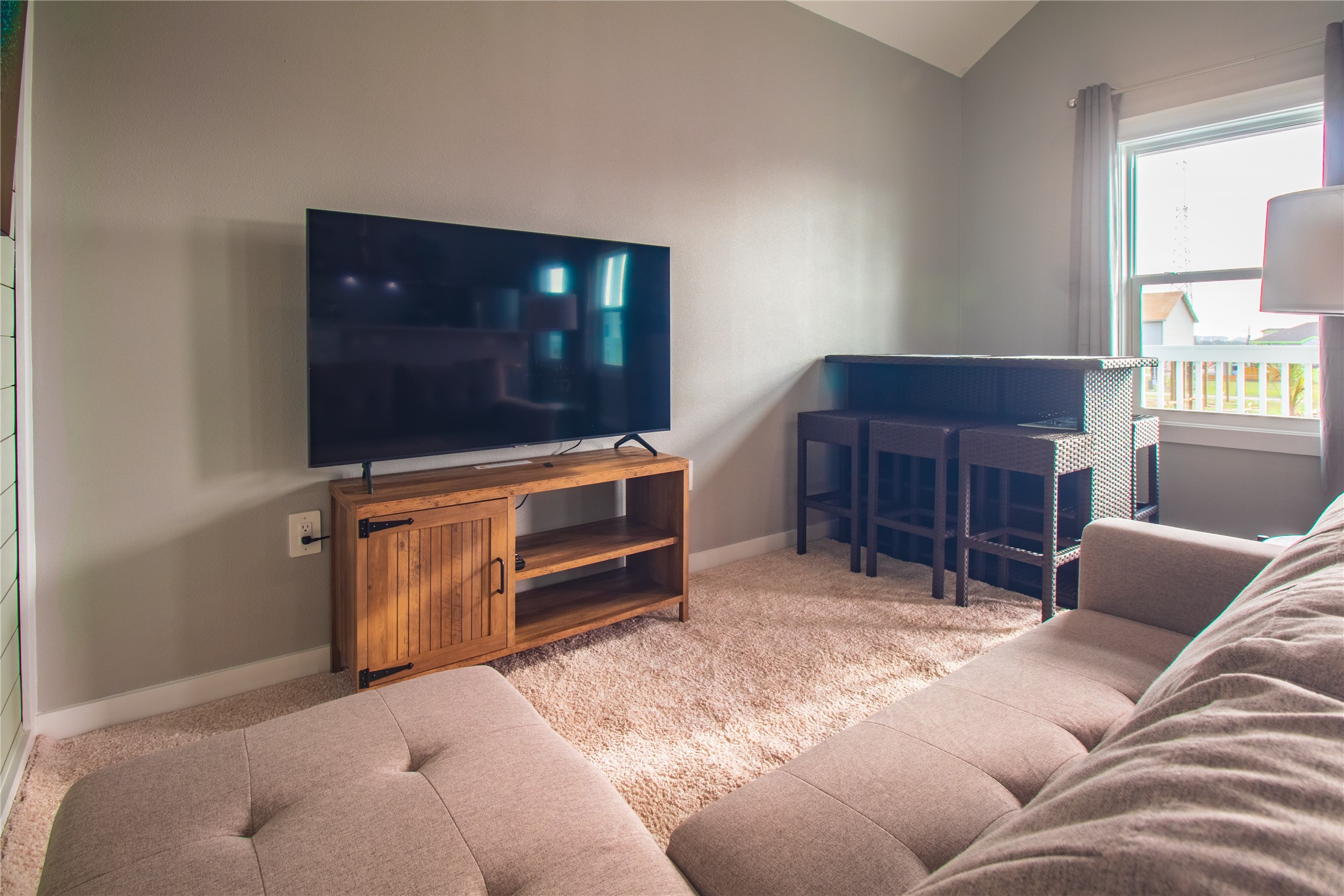 1040 Johnson Road Port Bolivar, TX 77650 - Photo 17 of 49 a living room with furniture a flat screen tv and a fireplace