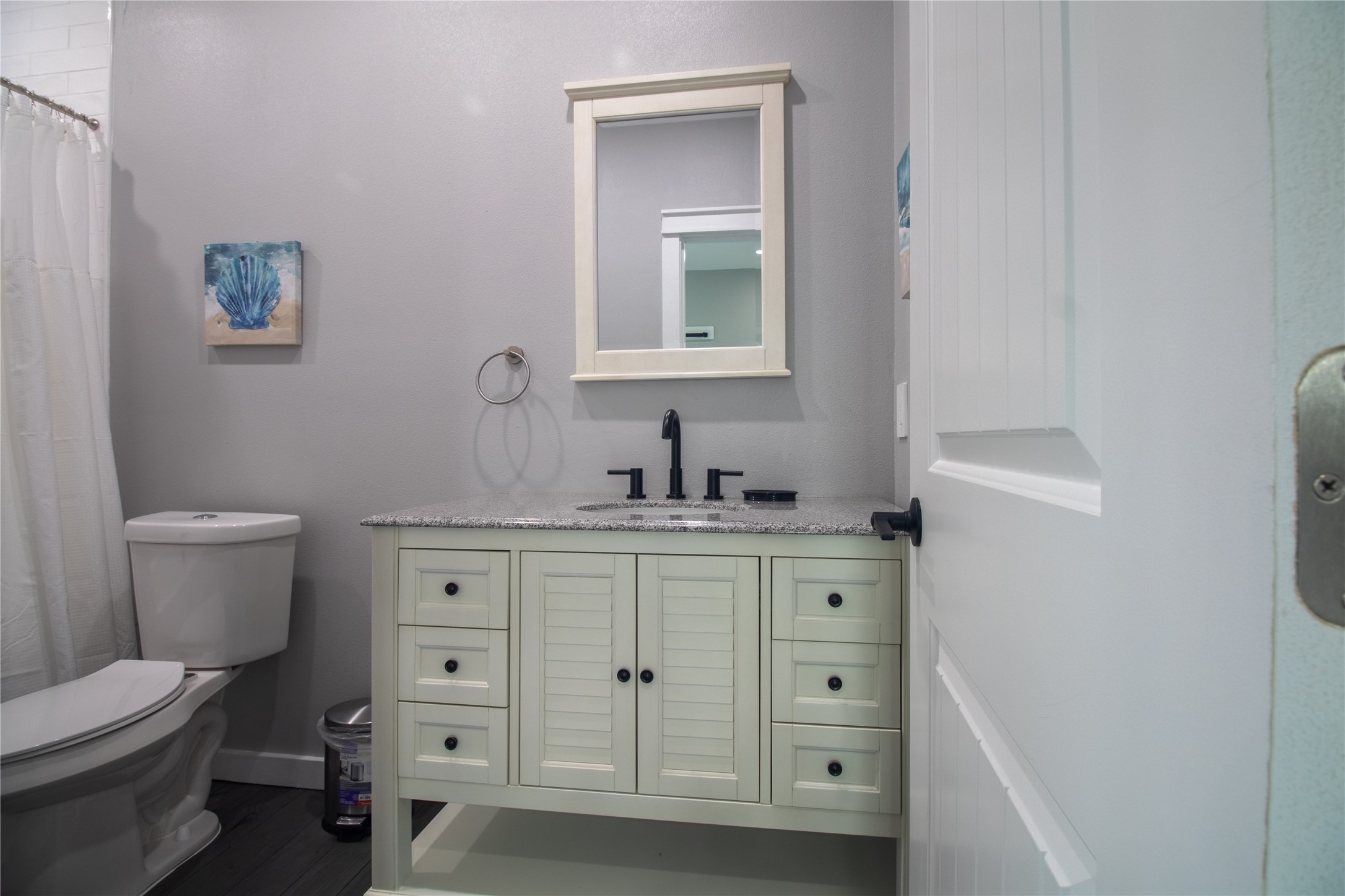 1040 Johnson Road Port Bolivar, TX 77650 - Photo 30 of 49 a bathroom with a toilet a sink a vanity and mirror
