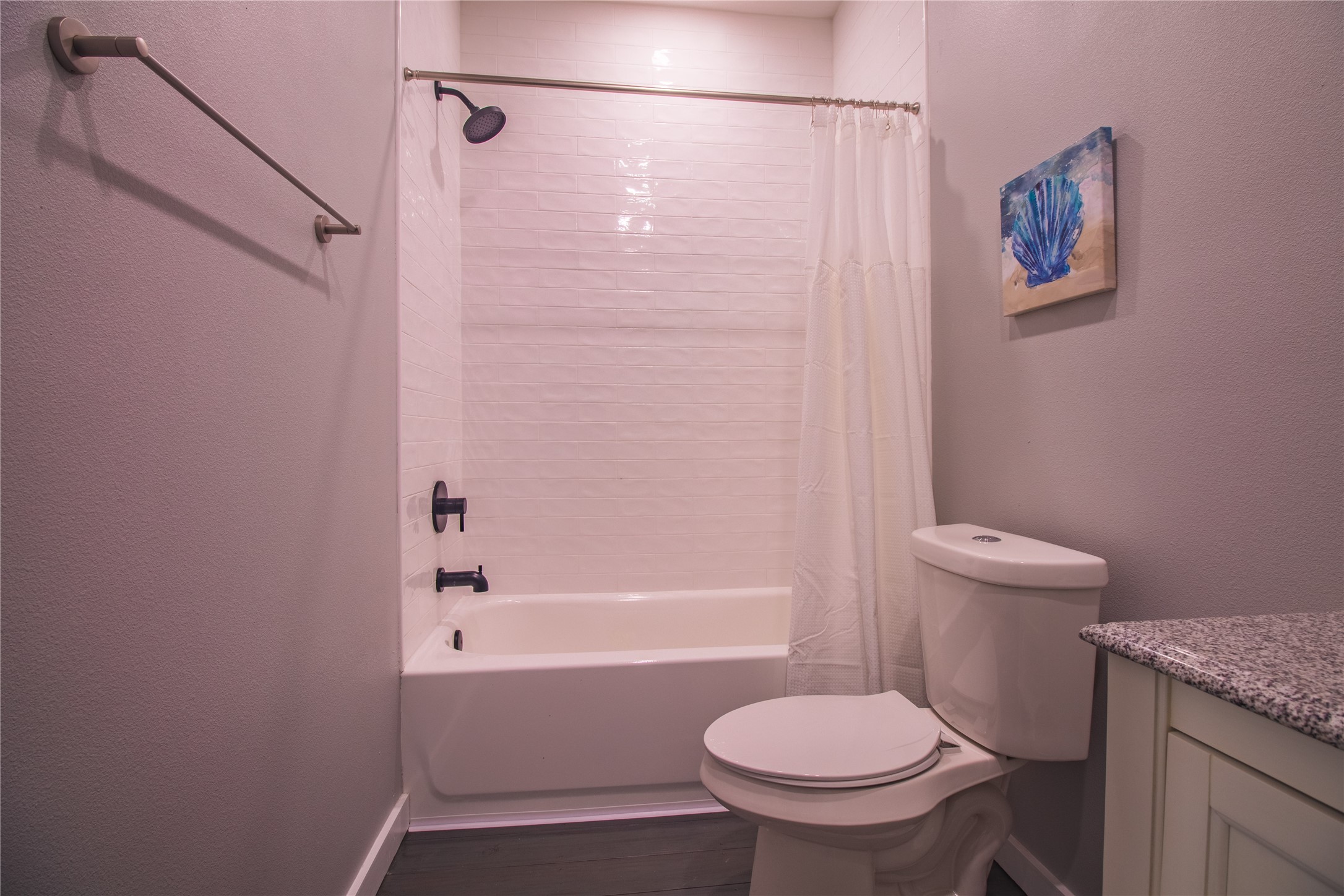 1040 Johnson Road Port Bolivar, TX 77650 - Photo 31 of 49 a bathroom with a granite countertop toilet and a bathtub