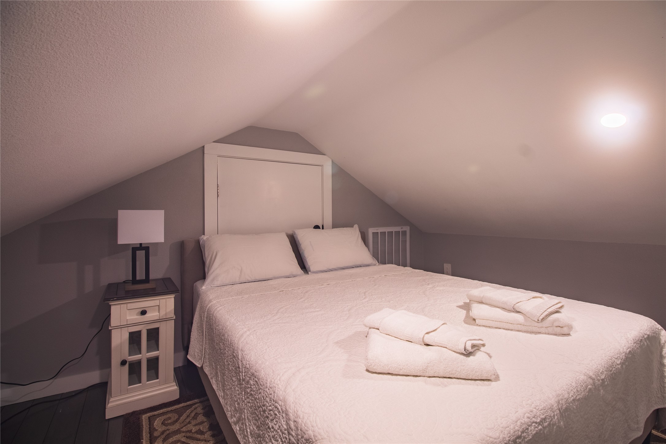 1040 Johnson Road Port Bolivar, TX 77650 - Photo 35 of 49 a bedroom with a bed and a night stand