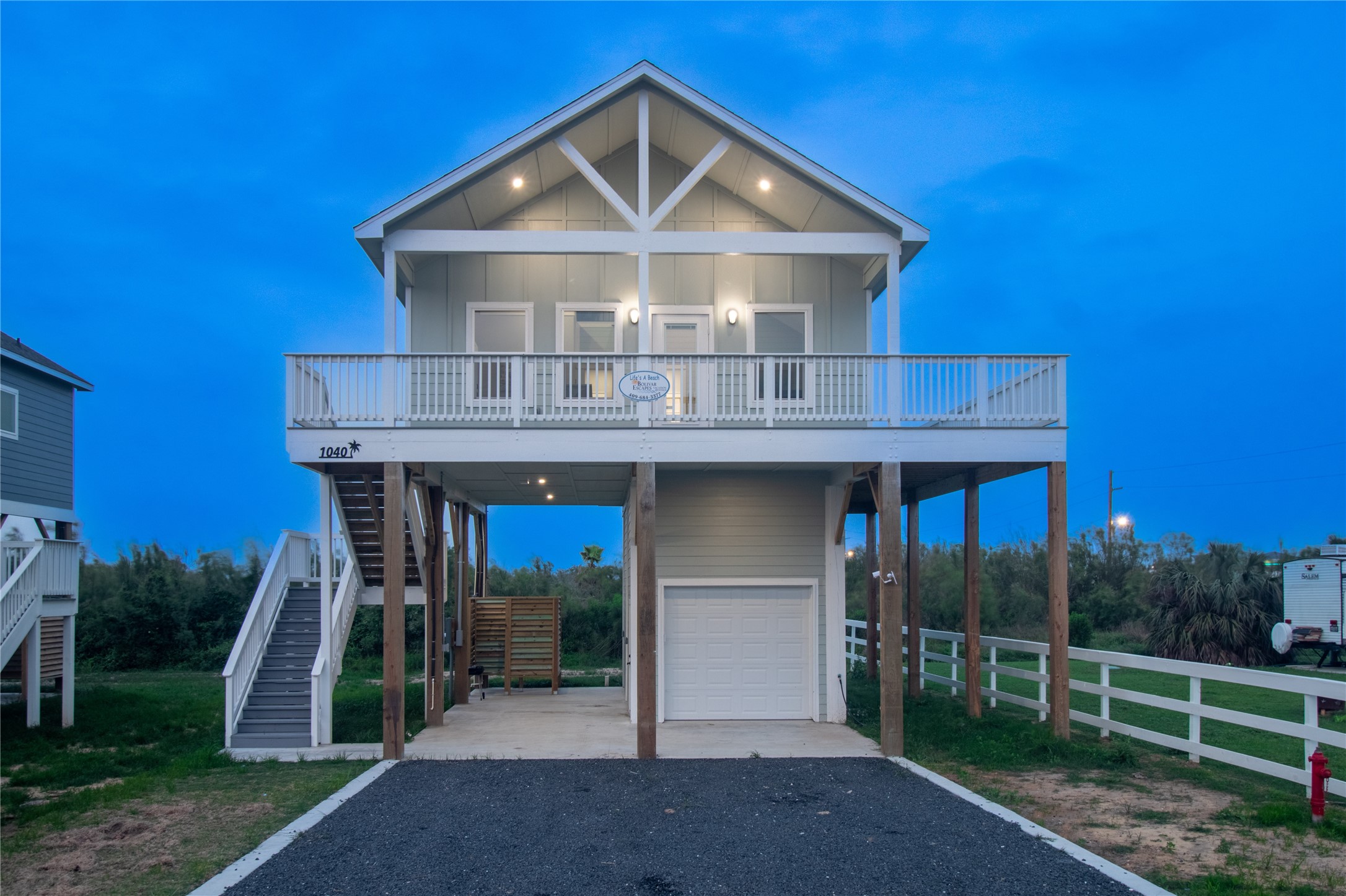 1040 Johnson Road Port Bolivar, TX 77650 - Photo 4 of 49 a front view of a house with garden