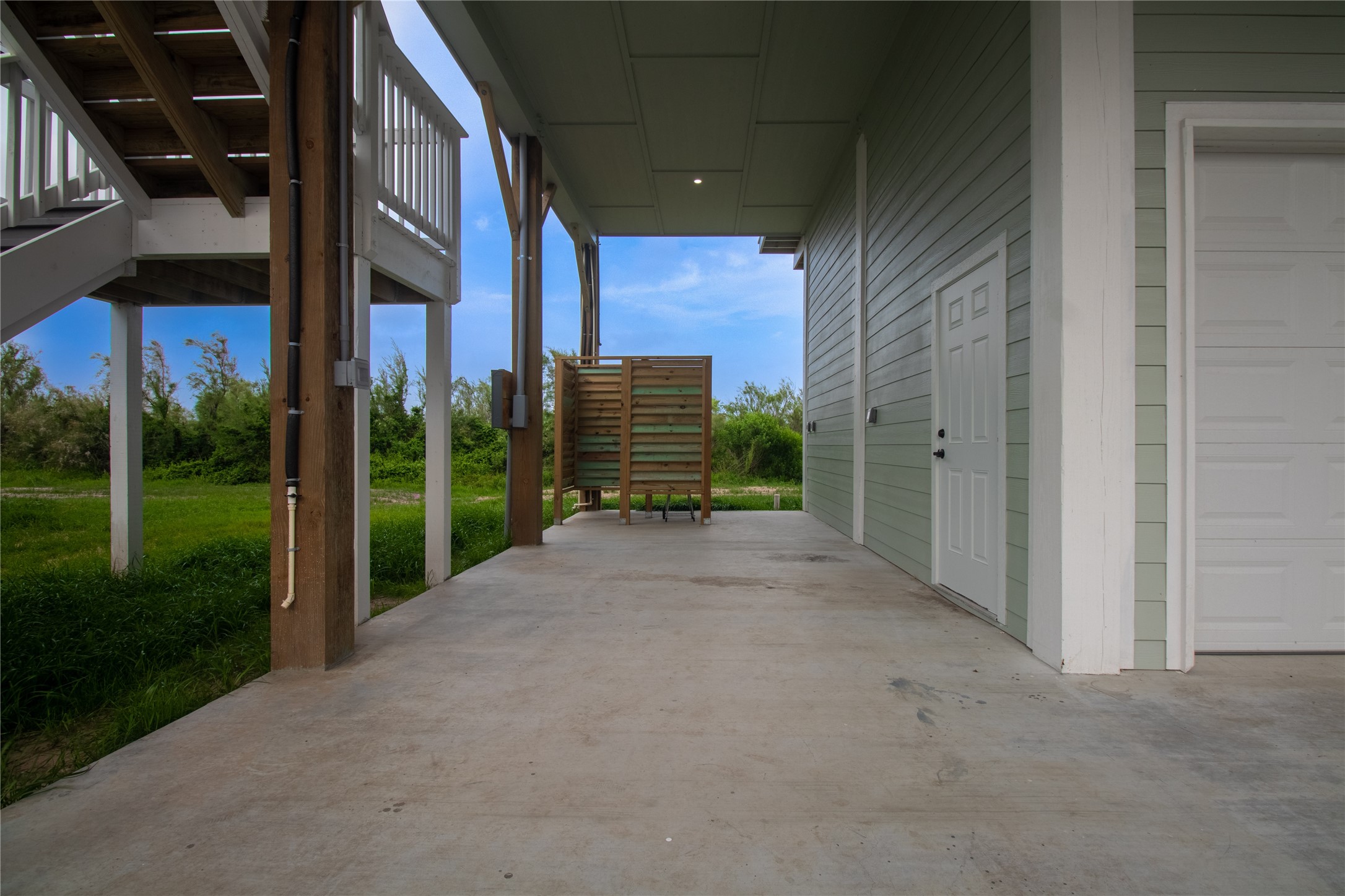 1040 Johnson Road Port Bolivar, TX 77650 - Photo 42 of 49 a view of a house with a yard and pathway