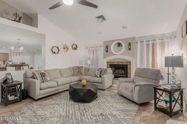 a living room with furniture and a fireplace