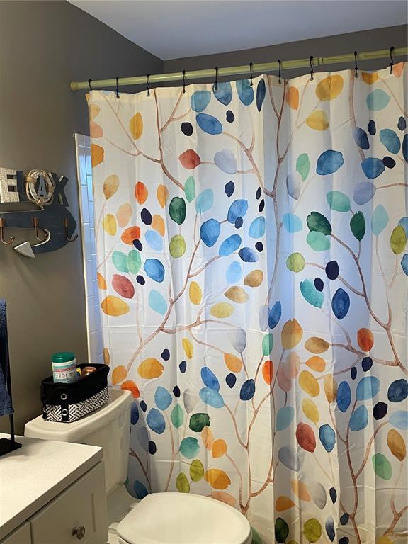 14531 Walsingham Road, Unit 203 Largo, FL 33774 - Photo 18 of 24 a bathroom with a sink and a curtain
