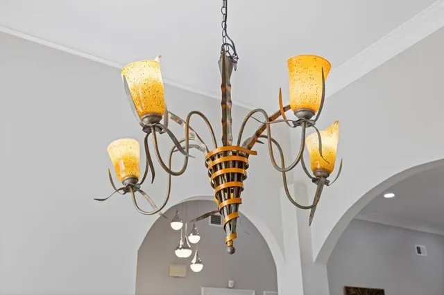 a kitchen with granite countertop cabinets stainless steel appliances and wooden floor