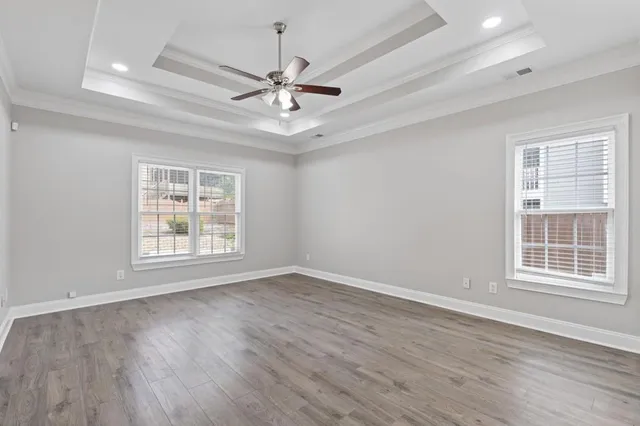 a bathroom with a toilet sink vanity and mirror
