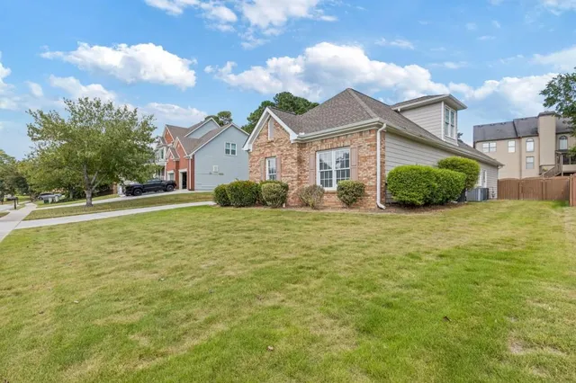 a front view of a house with a yard