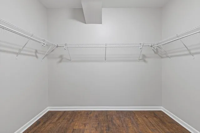 a white toilet sitting next to a bath tub