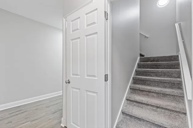 a view of a porch with a floor to ceiling window and an entrance