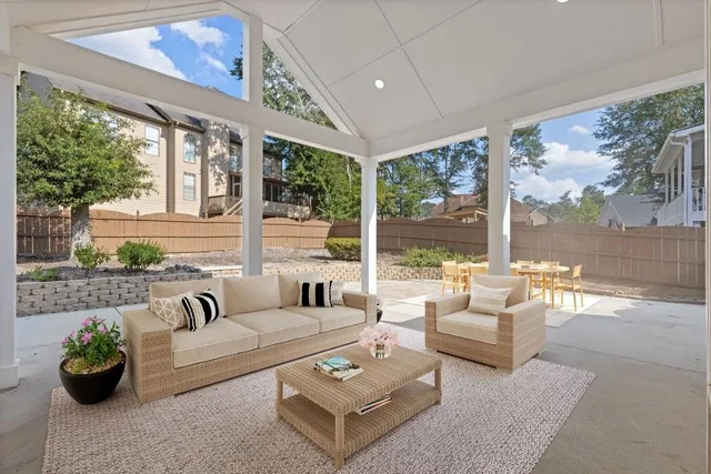 a view of a swimming pool with sitting area