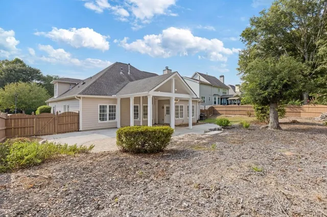 a view of a swimming pool with a yard