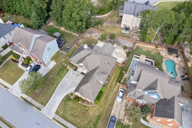 an aerial view of residential houses with outdoor space