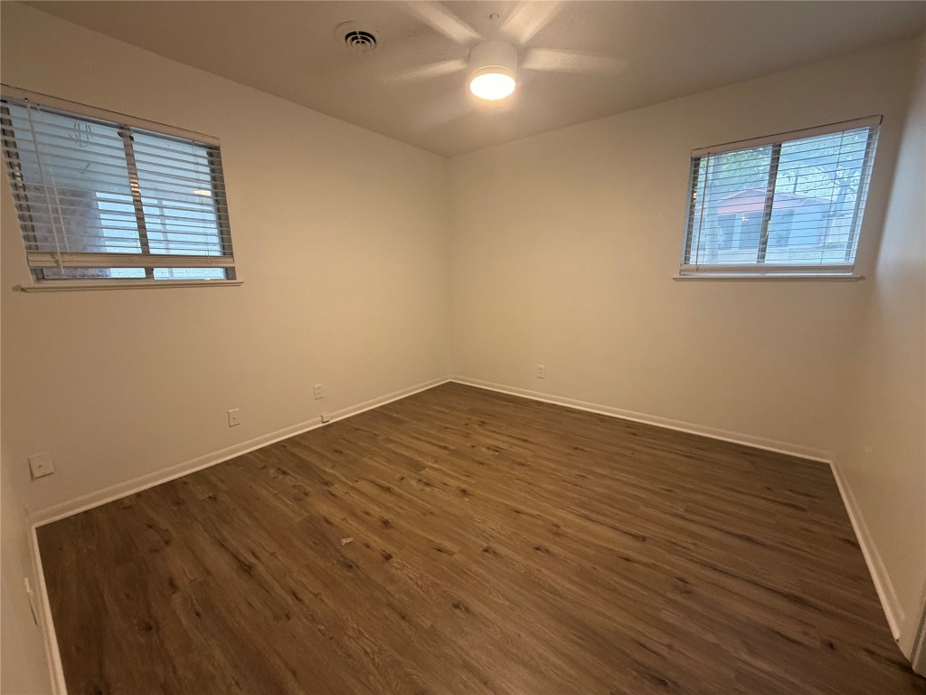 2308 Alta Vista Avenue, Unit B Austin, TX 78704 - Photo 10 of 23 a view of empty room with wooden floor and fan
