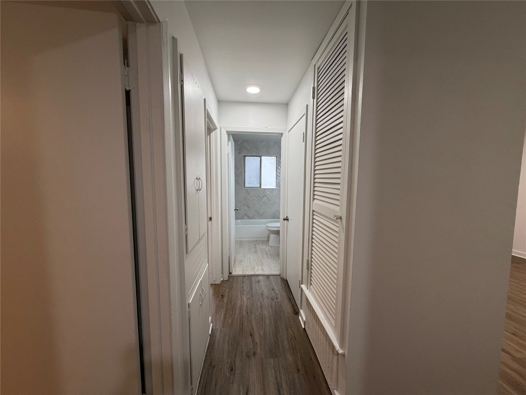 2308 Alta Vista Avenue, Unit B Austin, TX 78704 - Photo 11 of 23 a view of a hallway with wooden floor and a bathroom