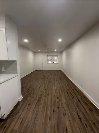 a view of a kitchen with a sink and a stove top oven