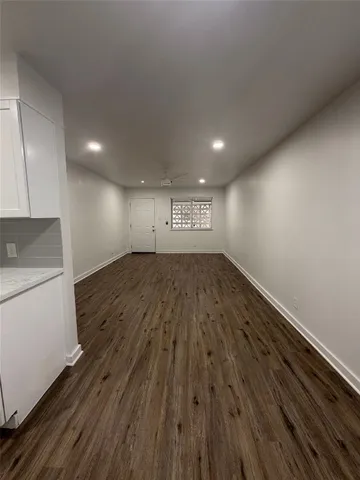 a view of a kitchen with a sink and a stove top oven