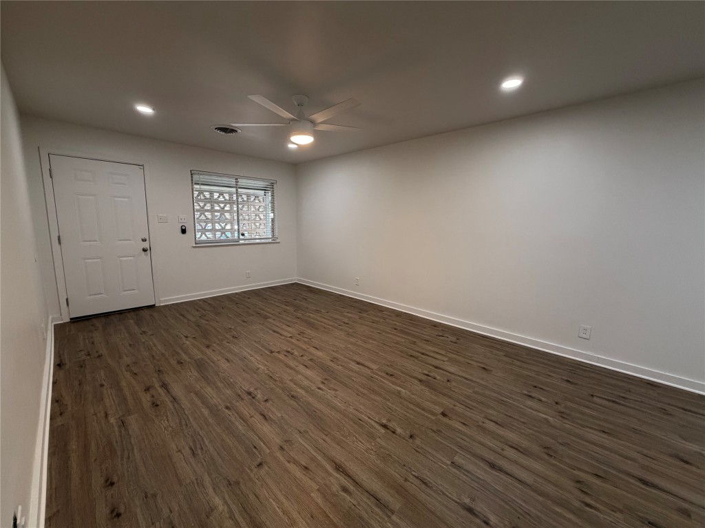 2308 Alta Vista Avenue, Unit B Austin, TX 78704 - Photo 4 of 23 an empty room with wooden floor and windows
