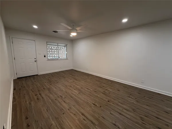 a view of an empty room and window