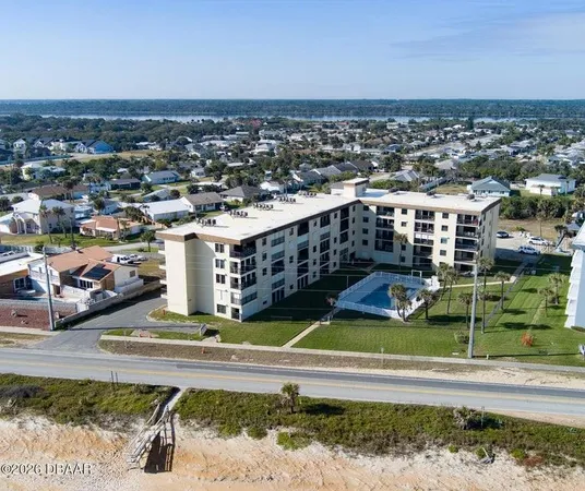a view of a swimming pool and a yard