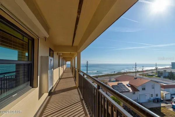 a view of balcony with furniture