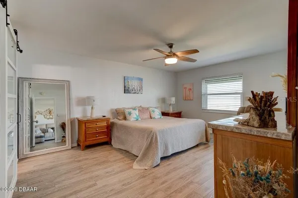 a bedroom with bed and window