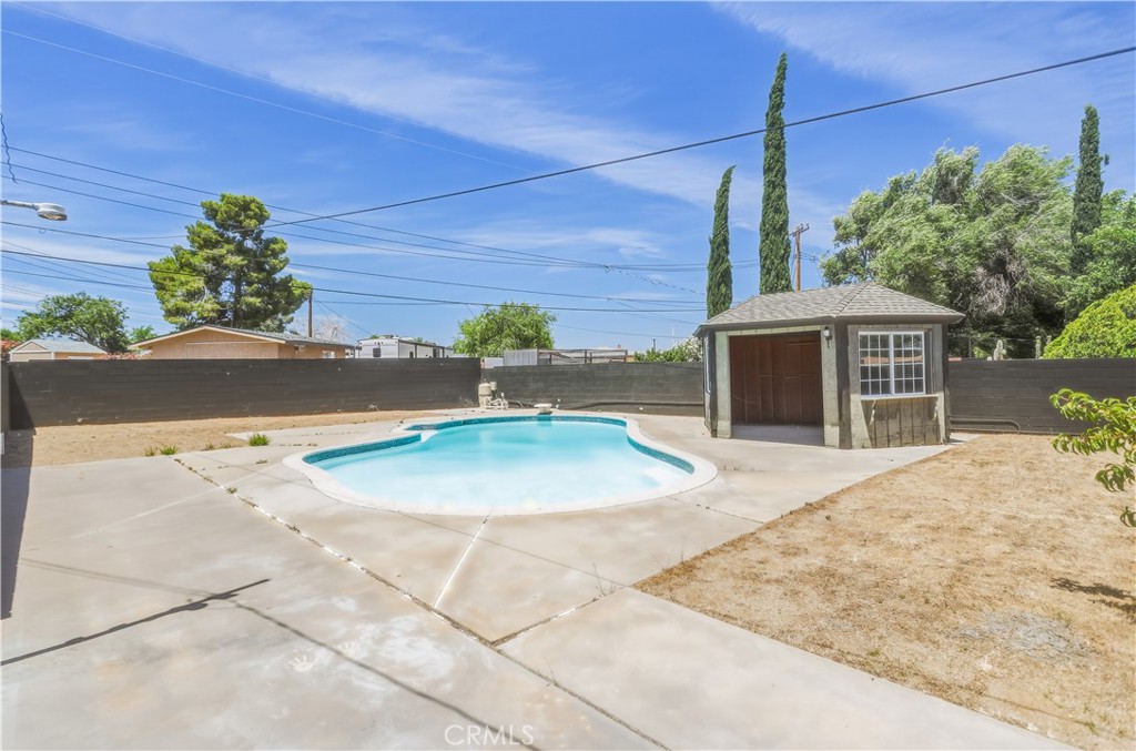 38859 Mesquite Road Palmdale, CA 93551 - Photo 32 of 36 a front view of a house with a yard