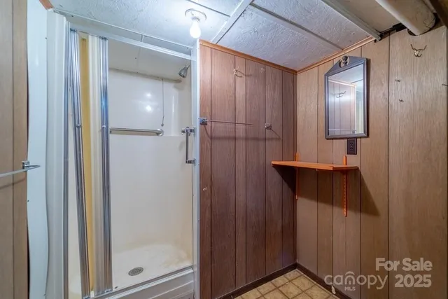 a bathroom with a shower and a sink