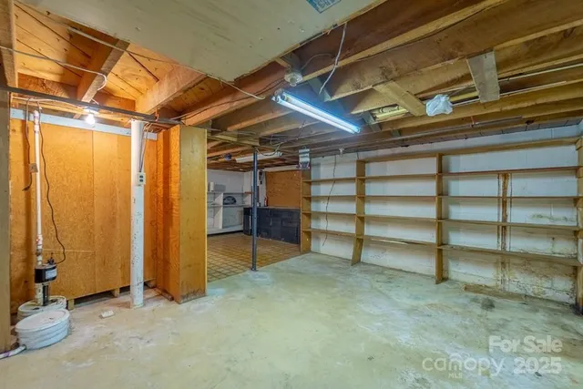 a view of an empty room with a staircase