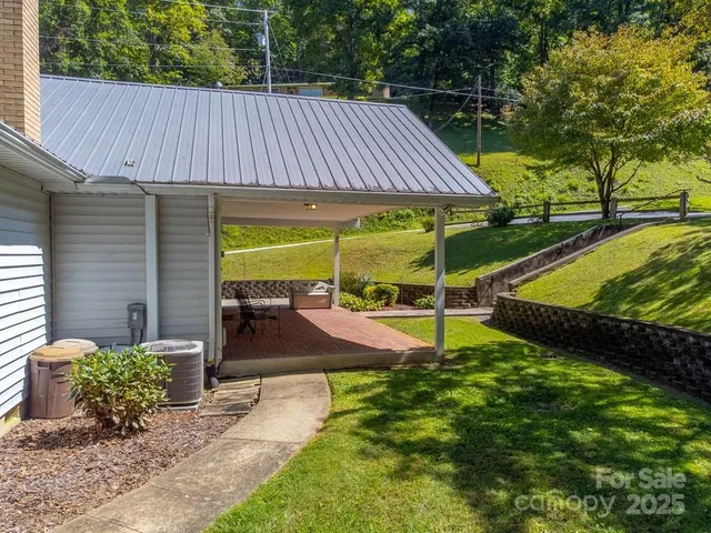 a view of a backyard with a patio