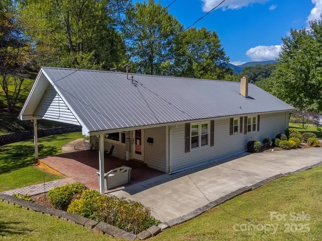 a house with trees in the background
