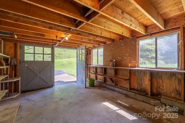 a view of a room with wooden walls