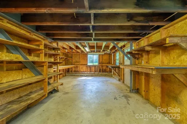 a view of an empty room with wooden walls