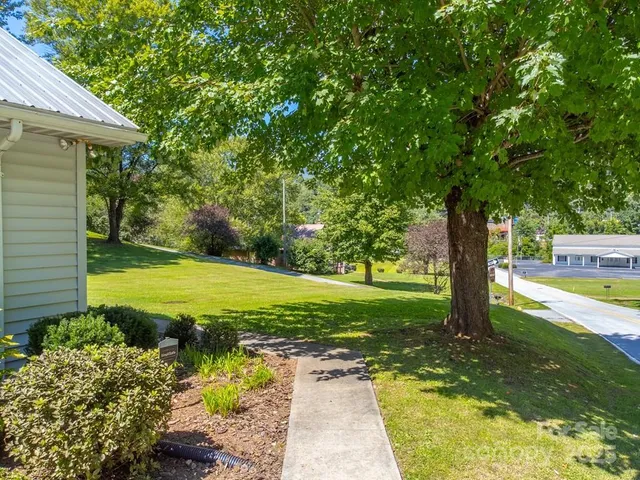 a view of a swimming pool with a yard