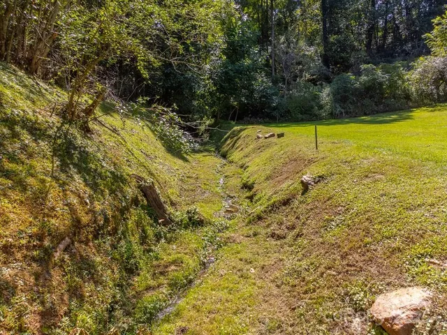 a view of a swimming pool and an outdoor space