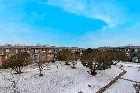 a view of a car parked in front of a building