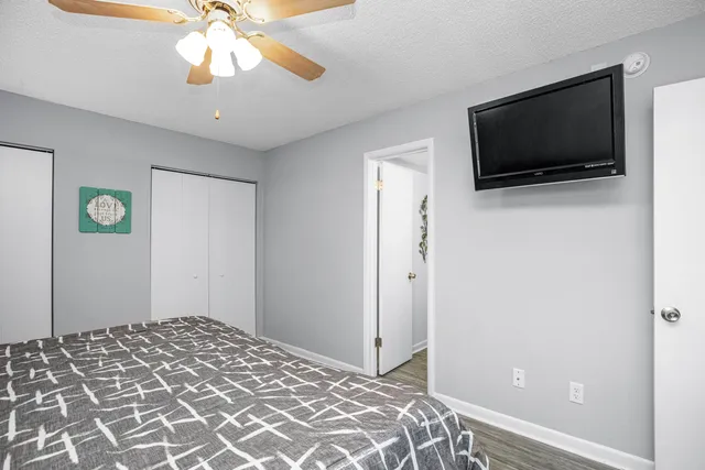 a bedroom with a bed and a chandelier