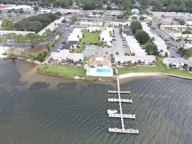 an aerial view of a house with outdoor space
