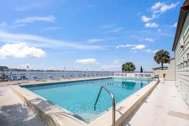a view of swimming pool from a balcony