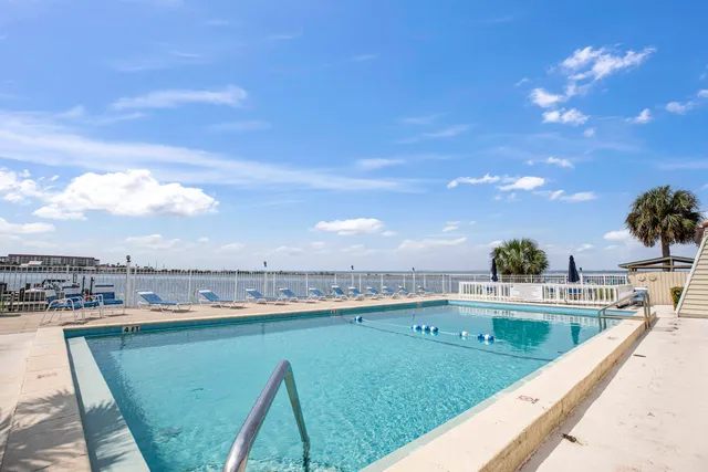 a view of a swimming pool from a balcony