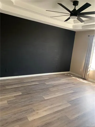 a view of a livingroom with wooden floor