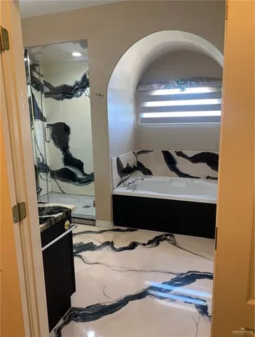 a bedroom with a bed and cabinets