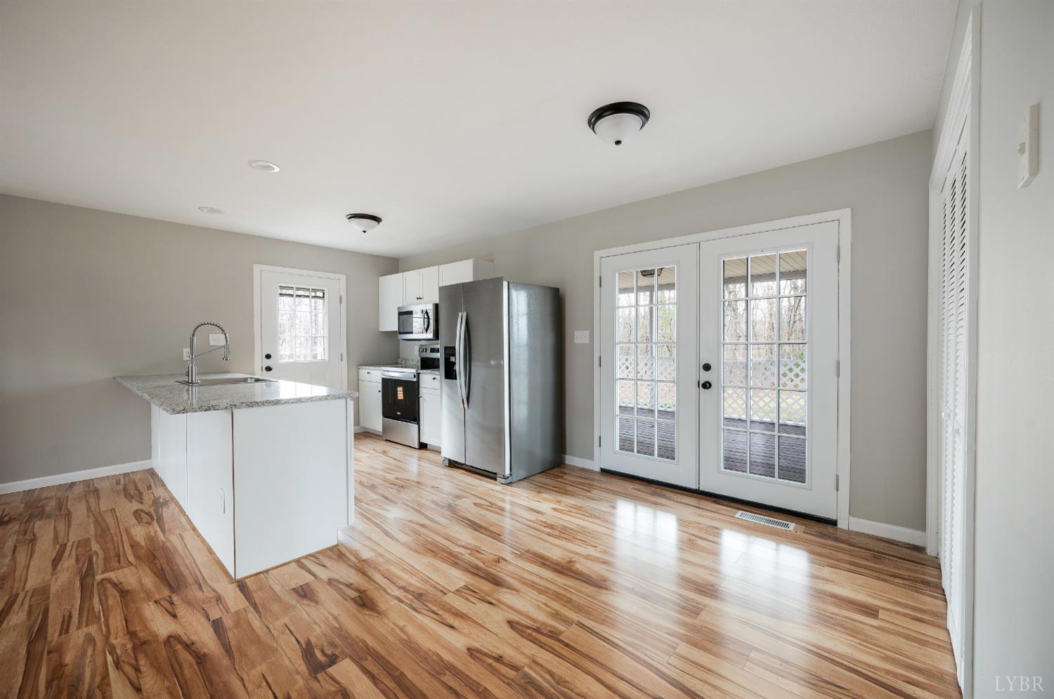 2365 Police Tower Road Appomattox, VA 24522 - Photo 11 of 52 a kitchen with granite countertop a refrigerator and a sink