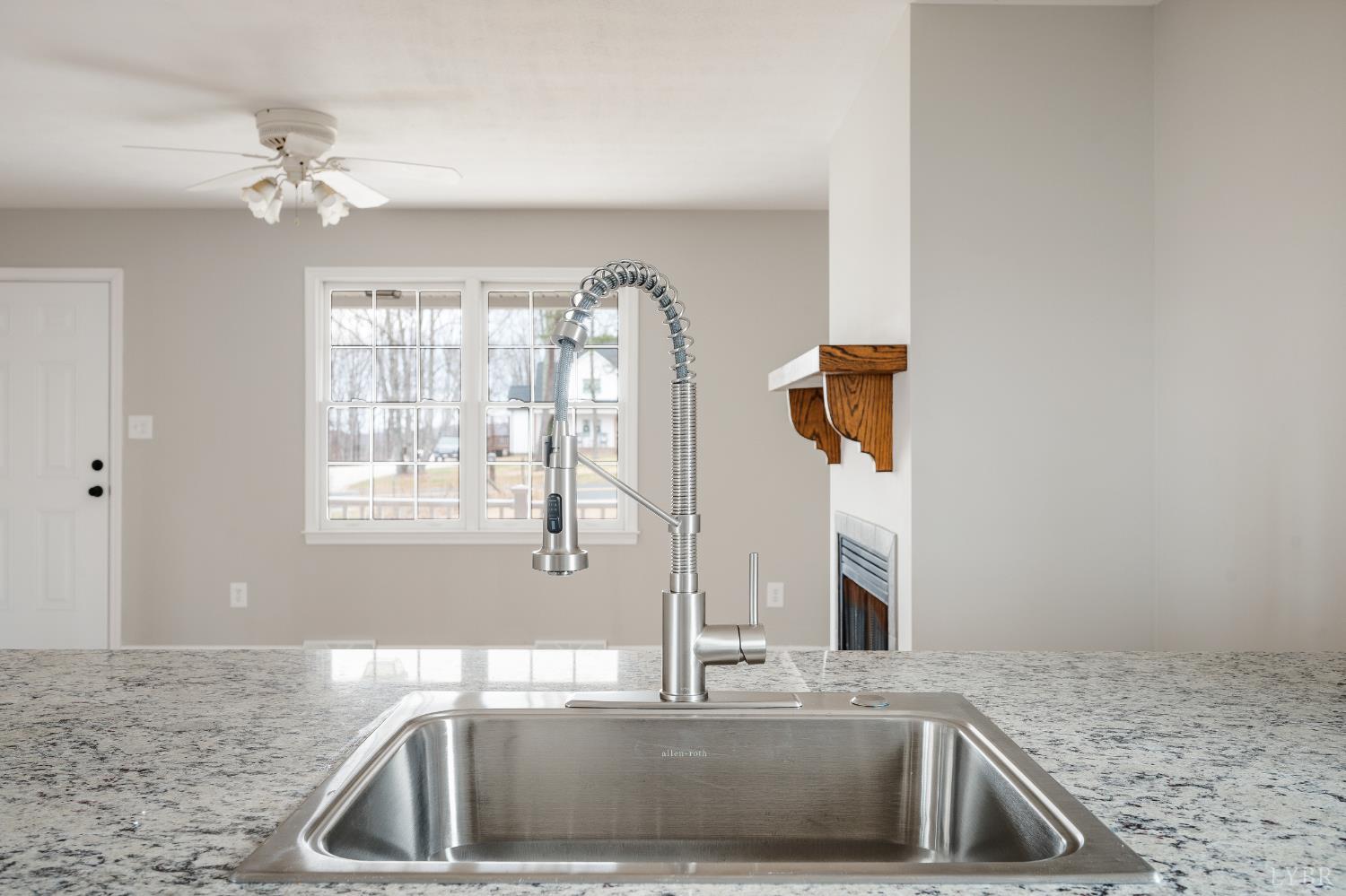 2365 Police Tower Road Appomattox, VA 24522 - Photo 15 of 52 a kitchen with a sink and a granite counter top