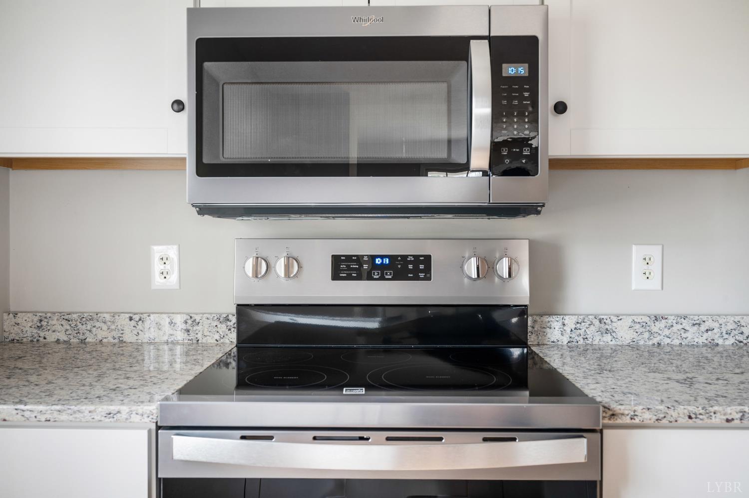 2365 Police Tower Road Appomattox, VA 24522 - Photo 17 of 52 a kitchen with stainless steel appliances granite countertop a sink and a microwave