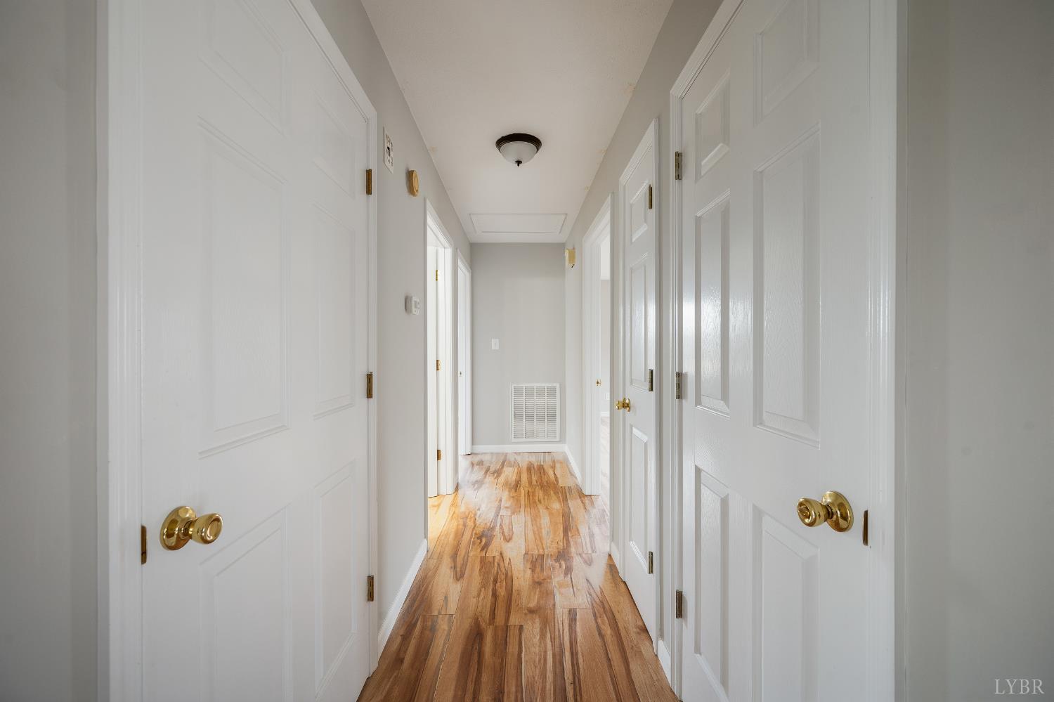 2365 Police Tower Road Appomattox, VA 24522 - Photo 18 of 52 a view of a hallway with wooden floor and staircase